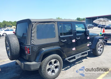2015 Jeep Wrangler Unlimited Freedom Edition z USA, uszkodzony, nr VIN 1C4BJWDG8FL573414